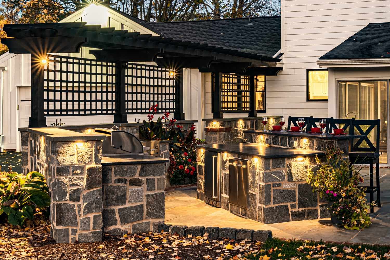 Custom Lit Outdoor Kitchen by First Class Lawn Care