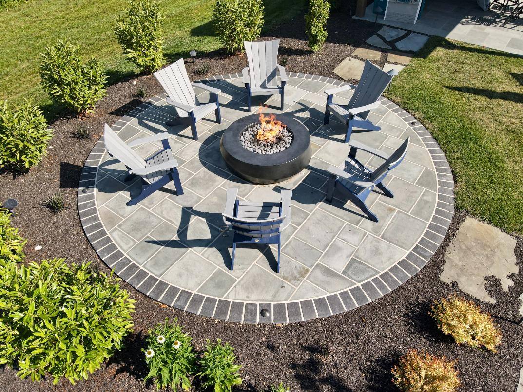 Firepit sitting area and patio by First Class Lawn Care in Wilmington, DE