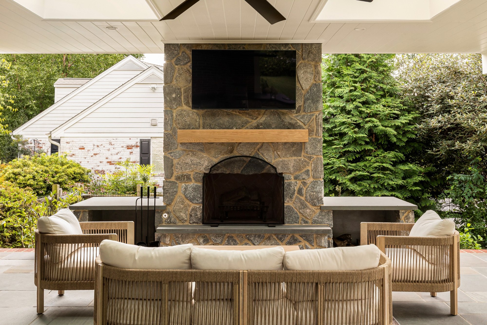 wilmington de patio project outdoor lounge facing stone fireplace with mounted tv