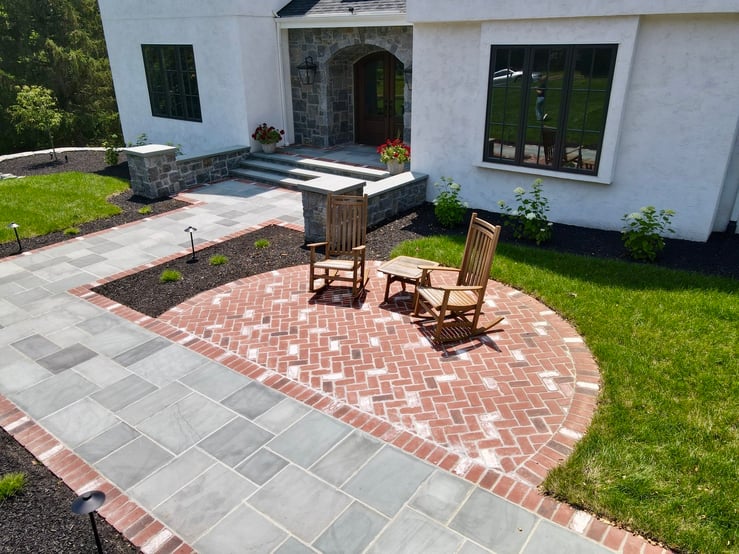 Beautifully hardscaped walkway and sitting patio in front of home by First Class Lawncare, LLC. in Wilmington, DE