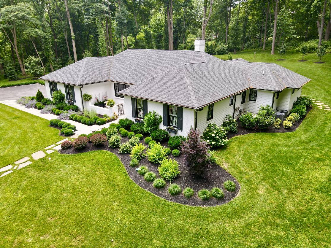 Aerial view of home yard landscaping by First Class Lawn Care in Wilmington, DE