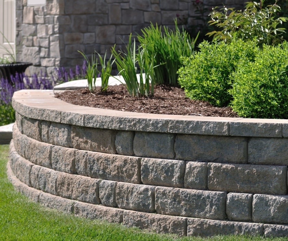 Retaining wall with plants and mulch