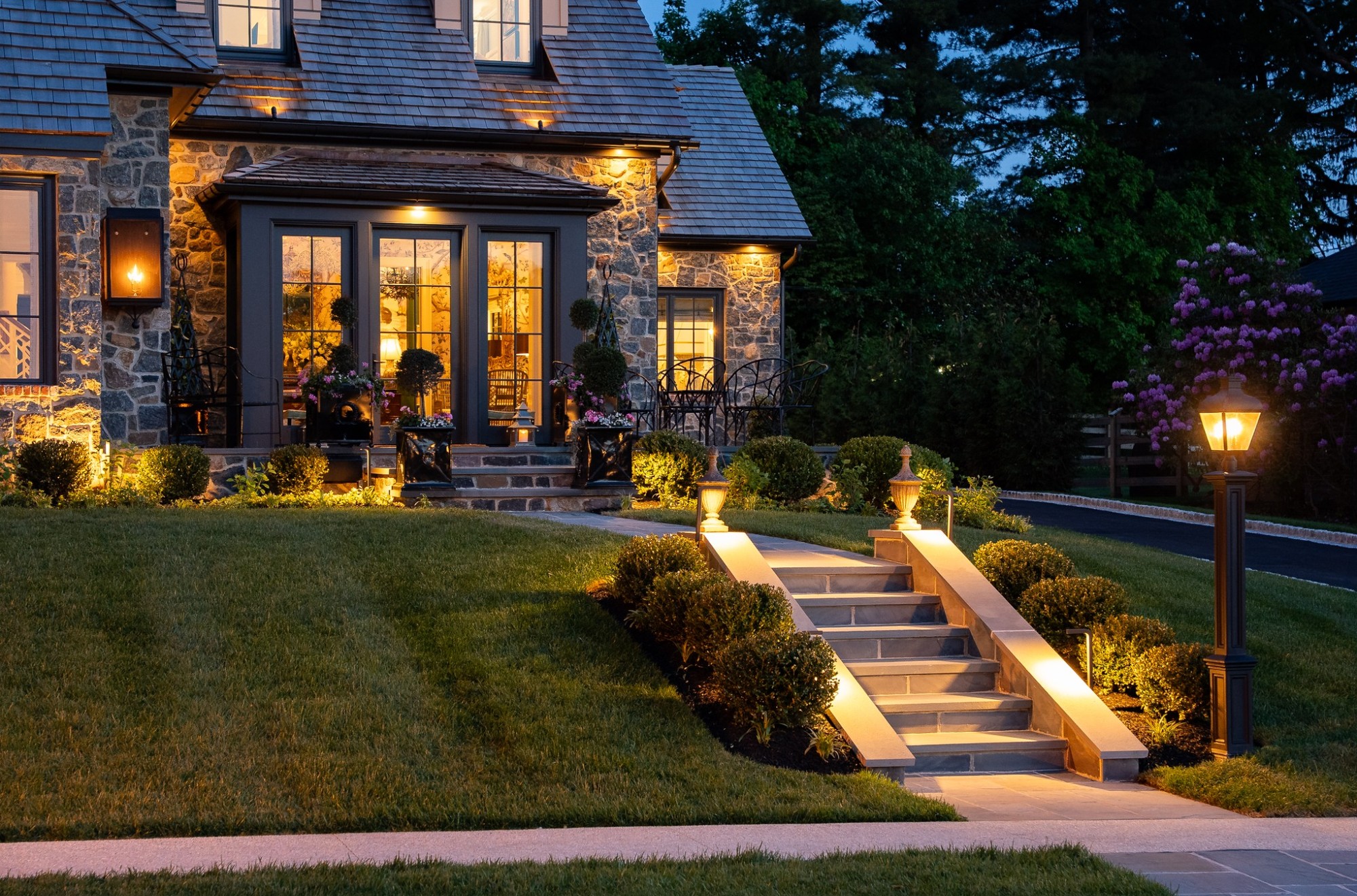 wilmington de exterior project illuminated stone entry patio with french doors and landscaped walkway